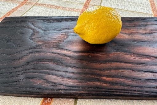 Charcoaled oak wood board-lemon